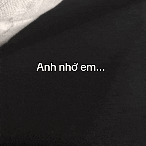 a black background with the words anh nho em written in white
