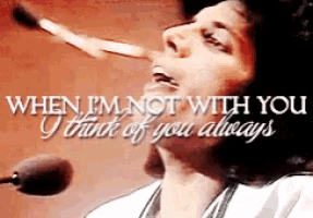 a woman singing into a microphone with the words when i 'm not with you i think of you always below her