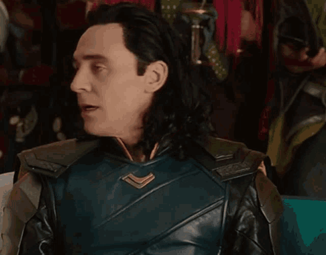a close up of a man in a superhero costume making a face .