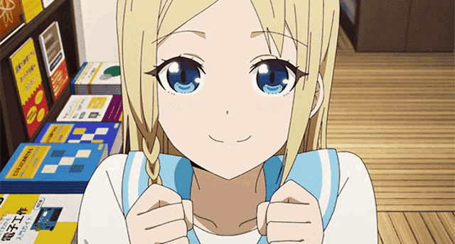 a girl with blonde hair and blue eyes is smiling in front of a bookshelf