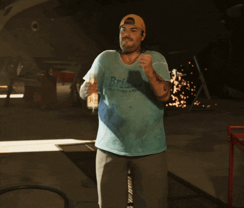 a man in a blue shirt that says bristol on it