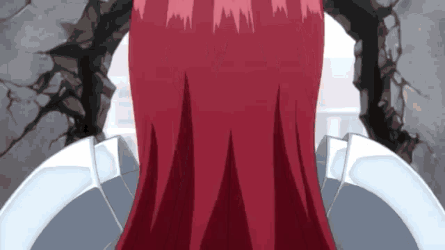 a woman with red hair is standing in front of a wall with a hole in it .