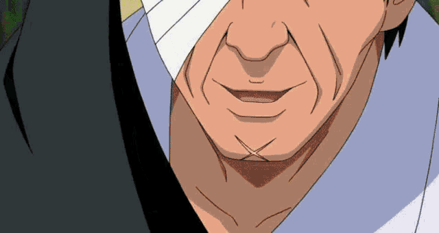 a close up of a man 's face with a bandage on his face .