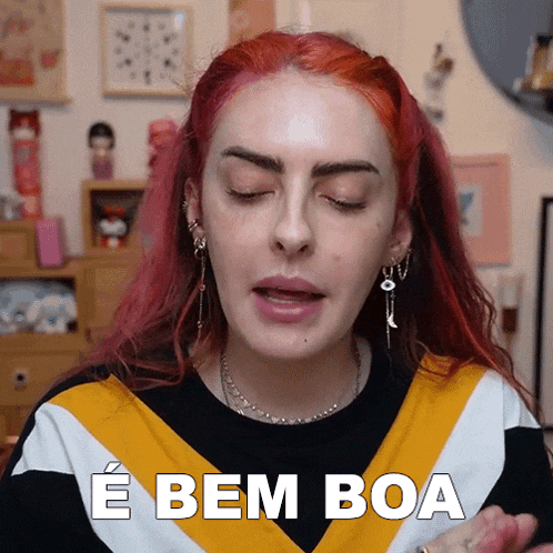 a woman with red hair says " e bem boa " in a foreign language