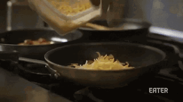 a person pouring cheese into a frying pan with the word eater on the bottom right
