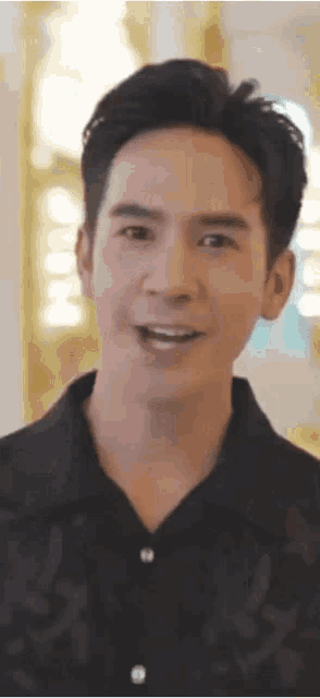 a close up of a man 's face with a smile on his face .