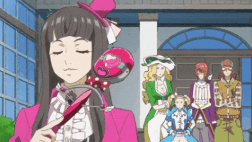 a woman in a pink suit is holding a heart shaped object in her hand