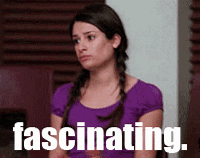 a woman in a purple shirt has the word fascinating written on her face