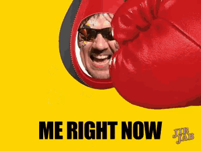 a man wearing sunglasses and a red boxing glove is being punched by a punching bag that says merri