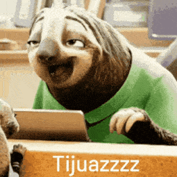 a cartoon sloth wearing a green shirt is sitting at a table with a tablet and smiling