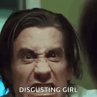 a close up of a man 's face with the words `` disgusting girl '' written below it .