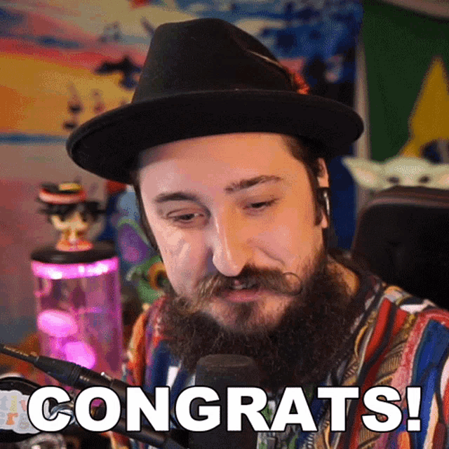 a man with a beard wearing a hat is saying congrats