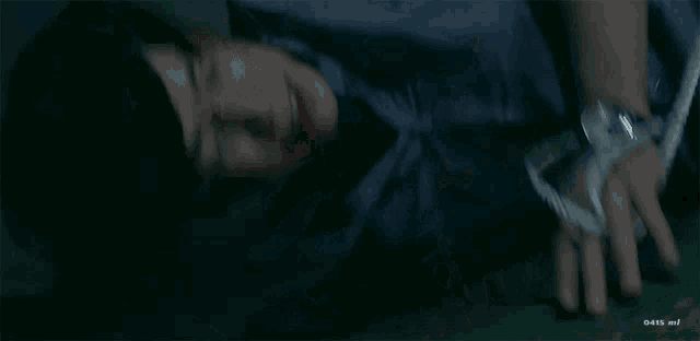 a man is tied up with a rope and has blood coming out of his face .