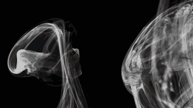a black background with smoke coming out of it