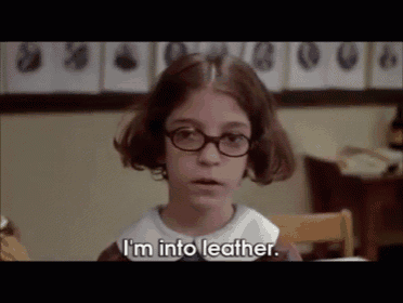 a young girl with glasses says i 'm into leather
