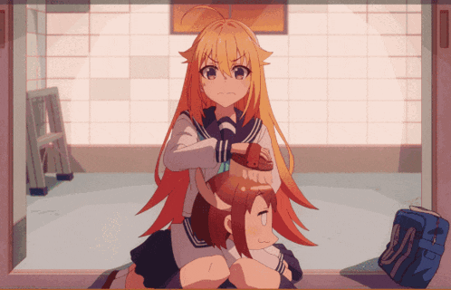 a girl with long blonde hair is sitting on another girl 's lap