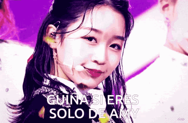 a close up of a woman 's face with the words " quina si eres solo de amy " above her