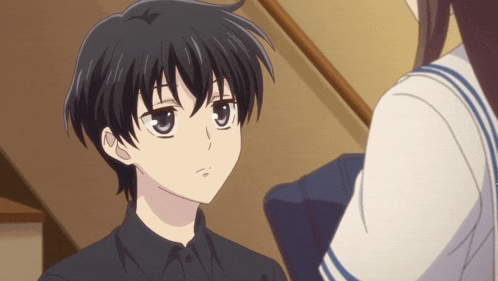 a girl in a sailor suit is standing next to a boy with black hair