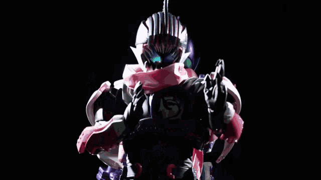 a man in a purple helmet is standing next to another man in a red and white helmet