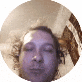 a close up of a man 's face with his eyes closed in a circle