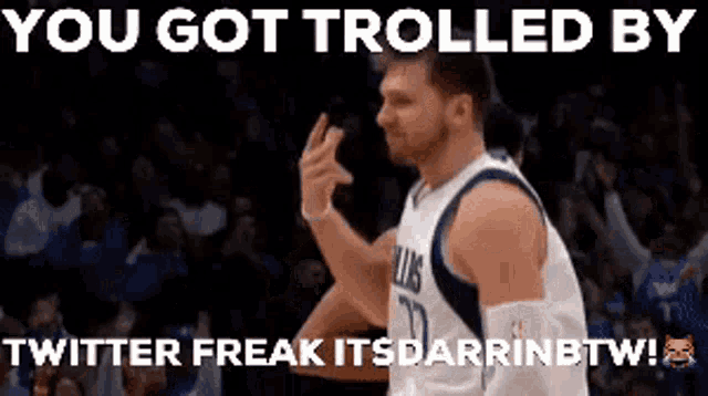 a basketball player in a dallas jersey is giving the middle finger