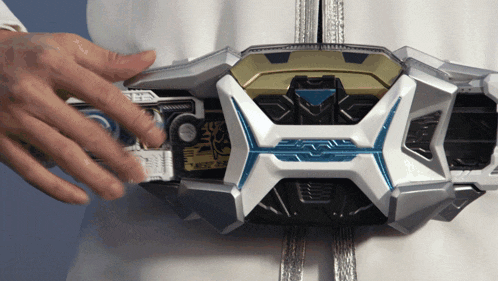 a close up of a person 's hand on a belt that says ' x '