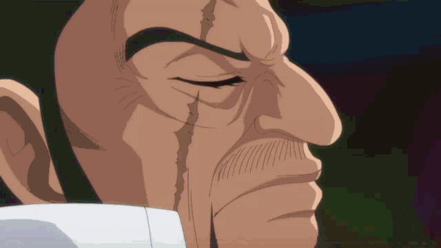 a close up of a man 's face with a tear running down his cheek