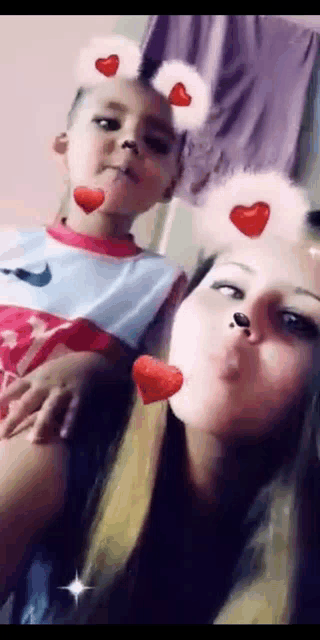 a woman and a child are posing for a picture together .
