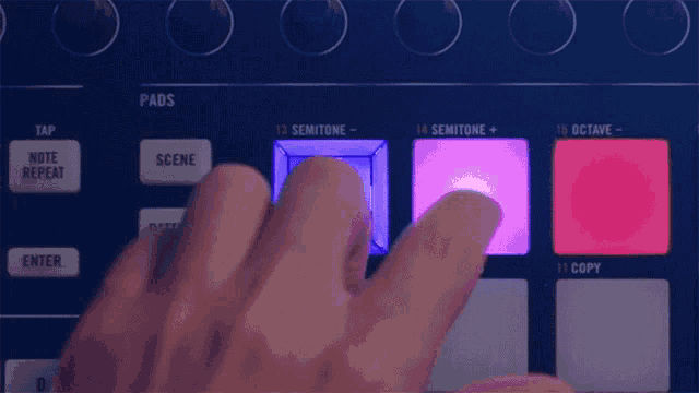 a close up of a person 's hand pressing a button on a keyboard