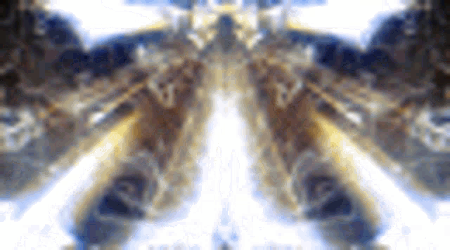 a close up of a butterfly 's wings with a reflection of a person in the background .