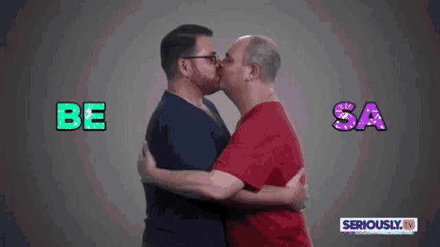 two men kissing with the words be sa behind them