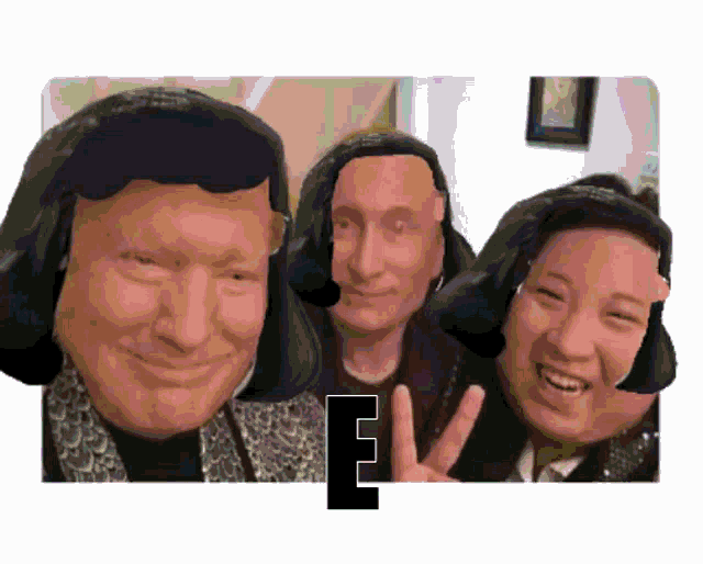 a group of people are posing for a picture and one of them is wearing headphones