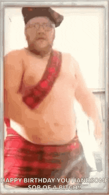 a shirtless man with a beard is wearing a kilt and a pirate hat .