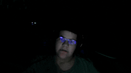 a blurry picture of a person 's face with purple eyes