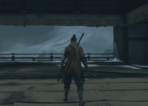 a person holding a sword in a dark room with a light coming out of the ceiling