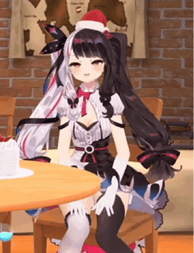 a anime girl is sitting at a table wearing a santa hat .