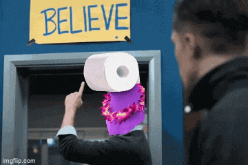 a man is pointing at a sign that says believe