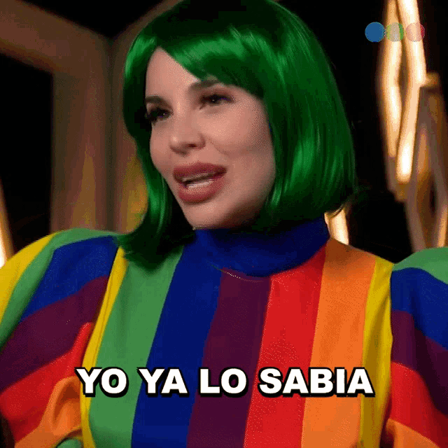 a woman with green hair is wearing a rainbow top and says yo ya lo sabia