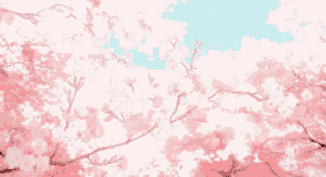 cherry blossoms are against a blue sky with clouds