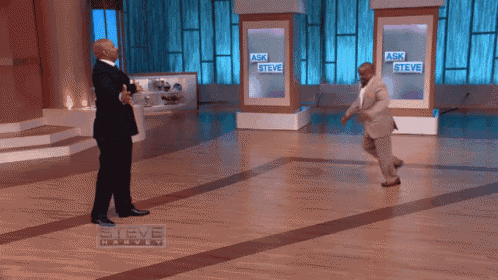 two men are dancing in front of a steve harvey sign