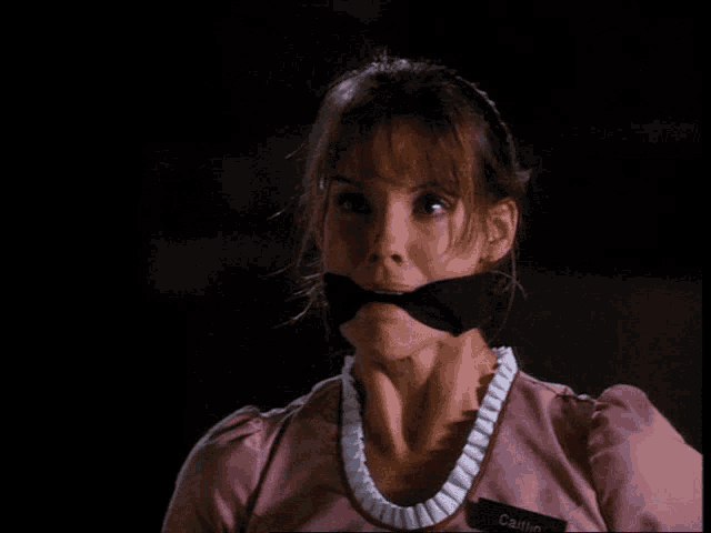 a woman with a name tag that says cait