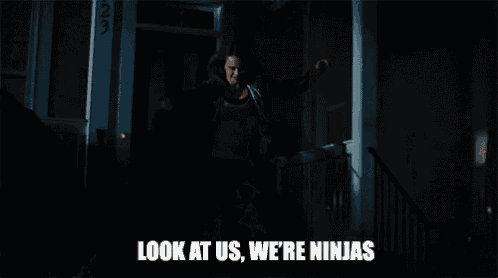 a blurry picture of a person saying `` look at us , we 're ninjas '' in the dark .