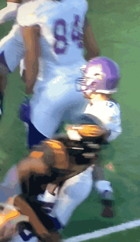 a football player wearing a white jersey with the number 84 on it