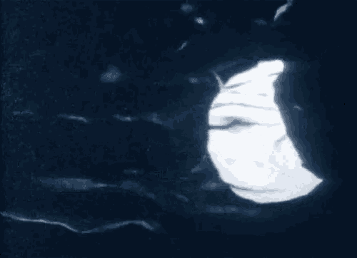 a close up of a person 's face with a hole in the middle of it .