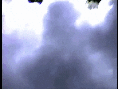 a person is flying through a cloudy sky with a white background