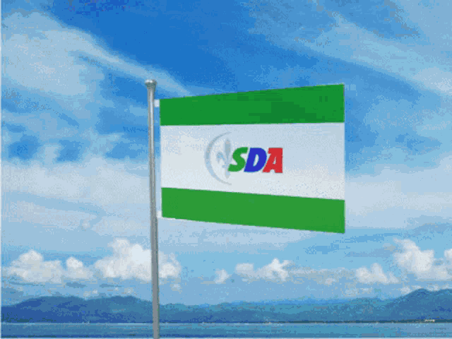a green white and blue flag with sda written on it