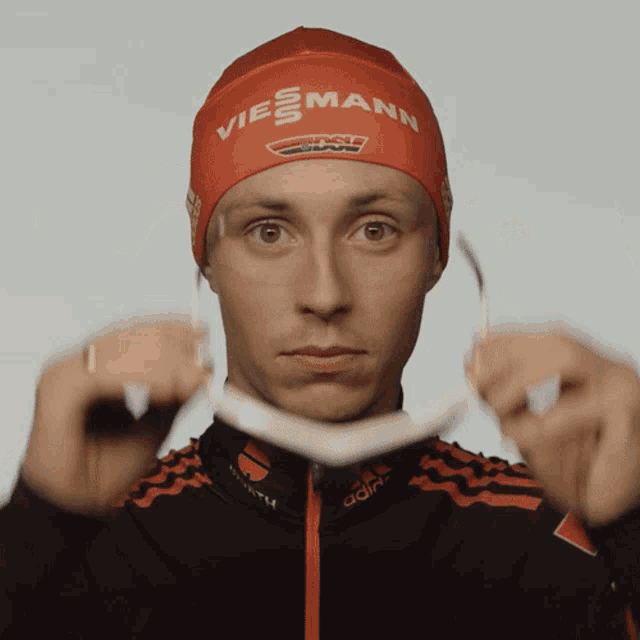 a man wearing a red hat that says viesmann