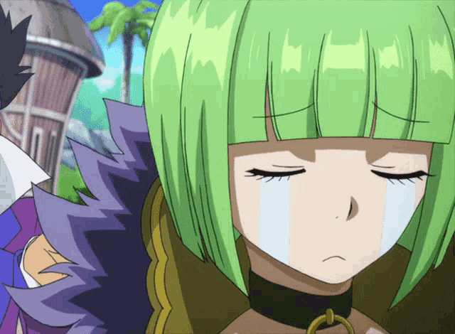 a girl with green hair is crying with a white tear running down her face