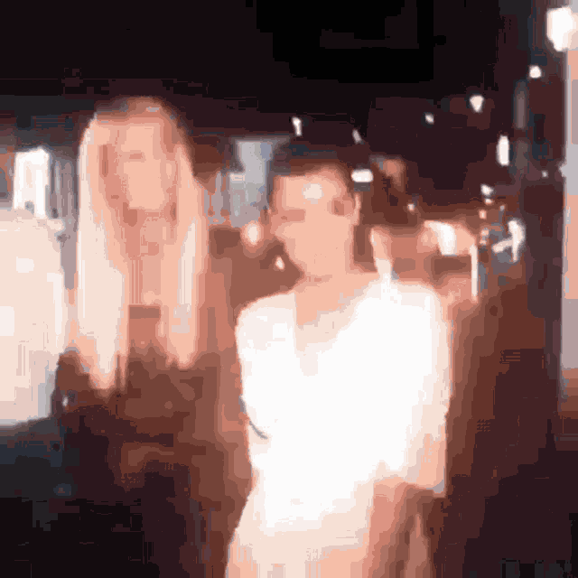 a blurry picture of a woman in a white dress