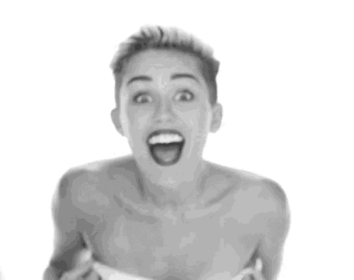 a black and white photo of a naked woman with her mouth open and a surprised look on her face .